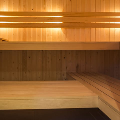 Unwind in the sumptuous sauna with a glass of bubbly