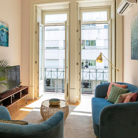 Throw open the floor-to-ceiling windows and listen to the street below