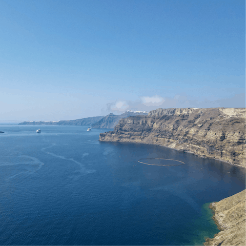 Explore Santorini's stunning coastline, with the nearest beach 750 yards away
