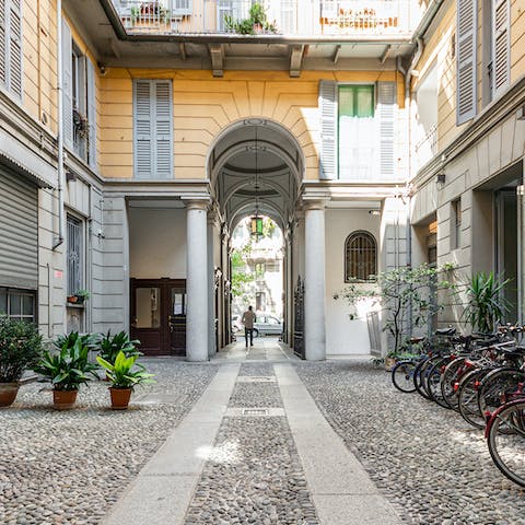 Admire the beautiful archway and central courtyard as you make your way to your apartmemt