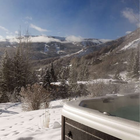 Take in the epic mountain views from the hot tub