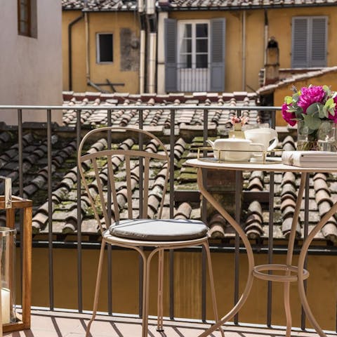 Enjoy a morning espresso and pastry on your private balcony 