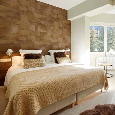 Sink into the hotel-quality bed after a long day on the snow