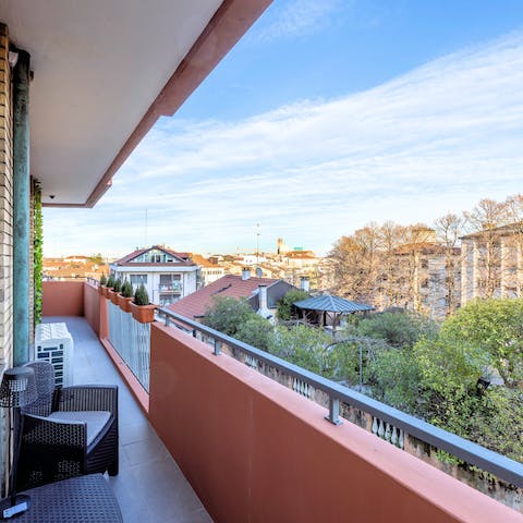 Enjoy a glass of wine on the balcony as you overlook the city