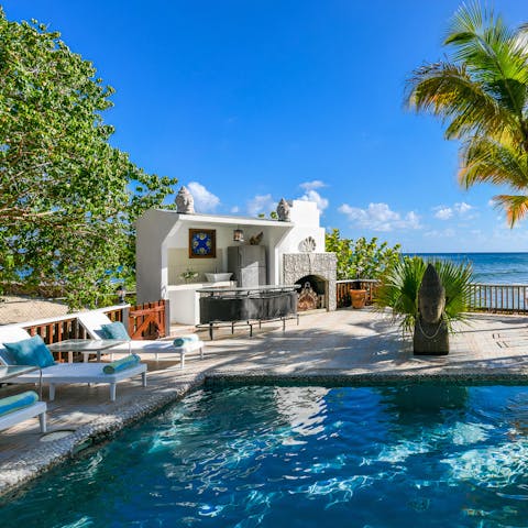 Spend sunny afternoons cooking in the outdoor kitchen an cooling off in the pool