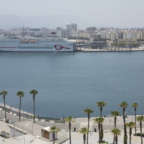 Take in the views from the bedroom over Málaga's port 