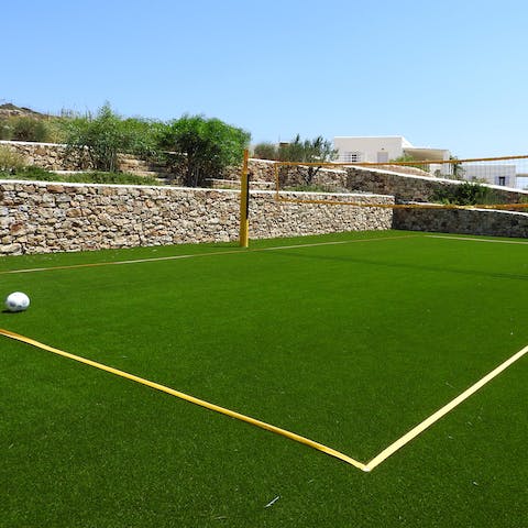 Play some volleyball or football on the villa's private courts