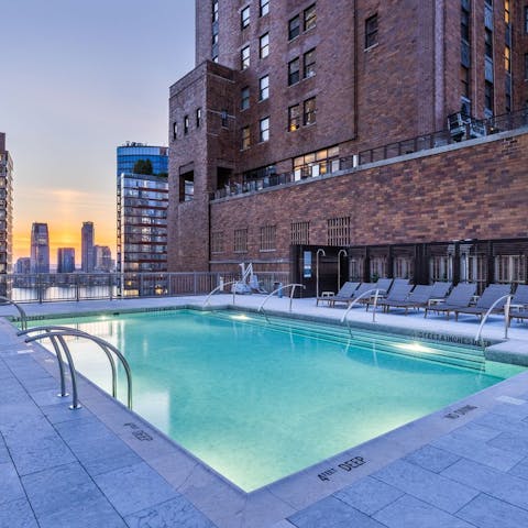 Enjoy a gentle swim at dusk in the communal rooftop pool