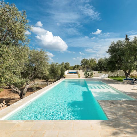 Swim lengths in this refreshing pool before gathering for a family picnic on the lawn