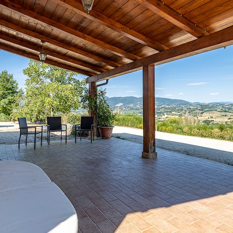 Enjoy sweeping views of the hills beyond from your shaded terrace
