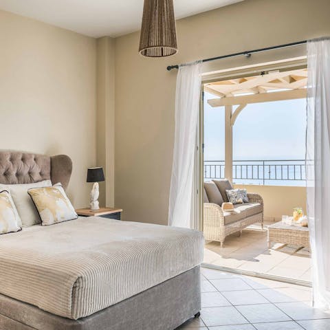 Wake up to the Mediterranean sun beaming onto the bedroom's balcony