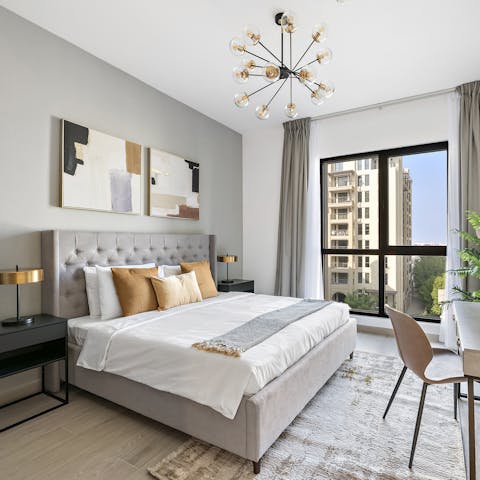 Wake up to floor-to-ceiling views before catching up on work at the desk