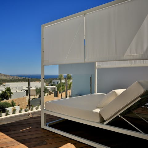 Admire the ocean views from the day bed, based on the balcony