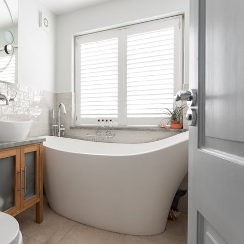 Treat yourself to a post-sightseeing soak in the standalone bathtub