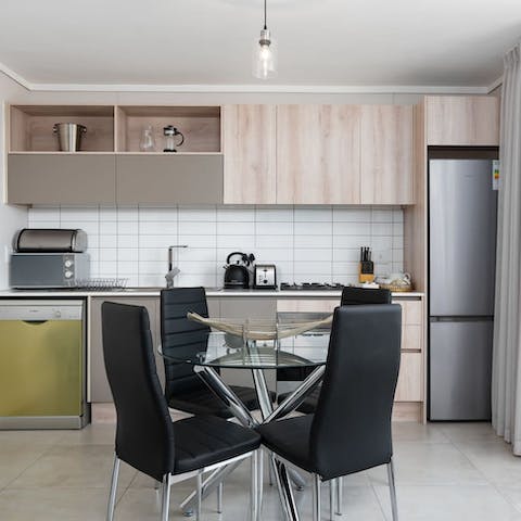 Prepare a homecooked meal in your well-equipped kitchen and tuck in around your sleek dining table