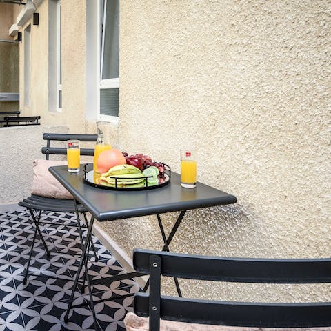 Start your days on your balcony with orange juice and fruit