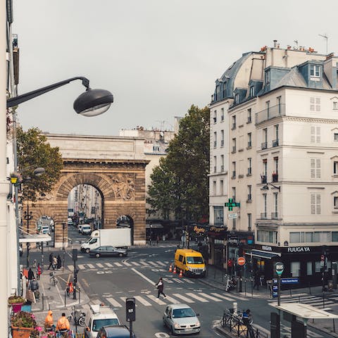 See the first triumphal arch built in Paris, just around the corner of your building