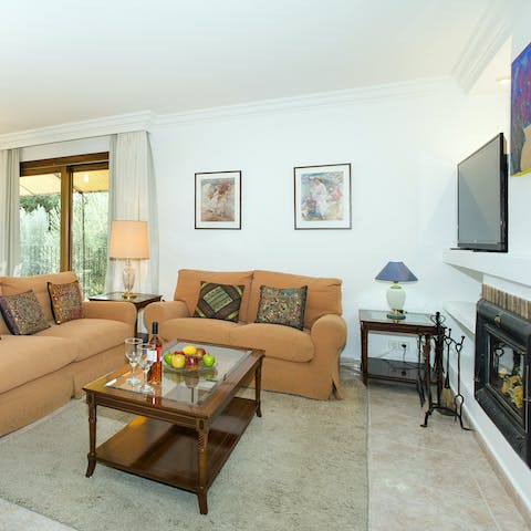 Kick back and enjoy a cosy evening in the elegant living room
