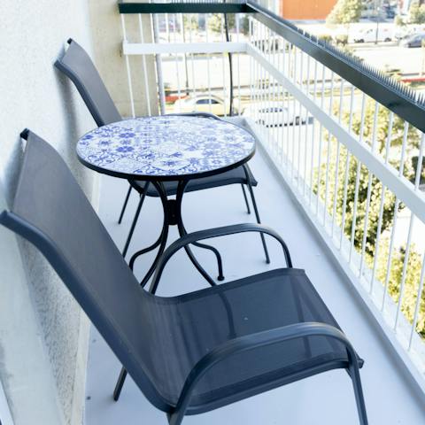 Enjoy your morning coffee on the balcony, overlooking the street below