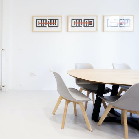 Relax around the dining table while a private chef works on a Greek spread