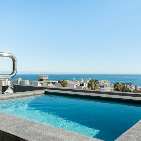 Soak up sweeping ocean views from the shared rooftop pool