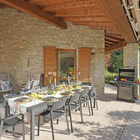 Gather on the covered terrace for a BBQ lunch in the sunshine