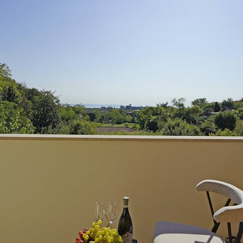 Kick back on the balcony with a glass of wine