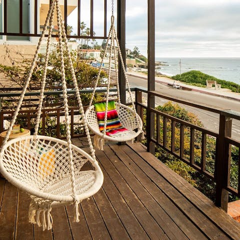 Take in sea views from the swing chairs on your private deck