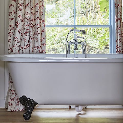 Relax with a soak in the clawfoot tub after a day of exploring the scenery