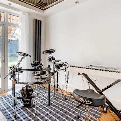 Practise your musical skills on the home's very own electric drum kit and digital piano