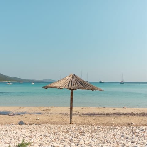 Drive seven minutes to Cala del Portixol beach