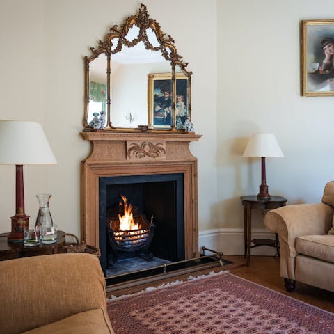 Get cosy around the fireplace in the living room
