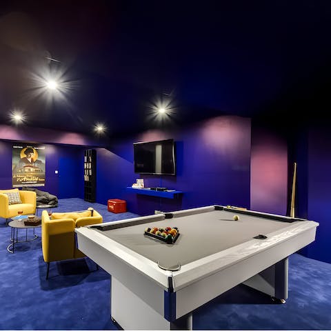 Kick back and relax in the vibrant games room after a busy day