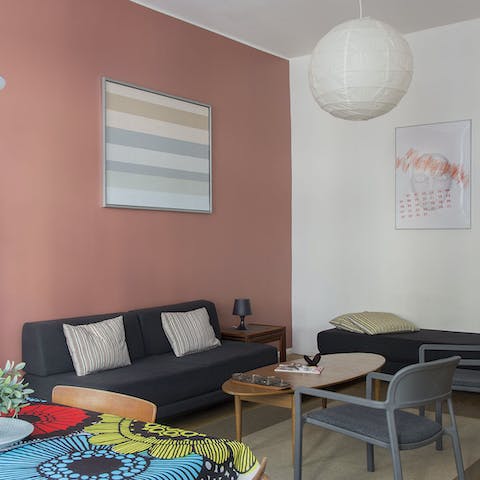 Relax in the pastel-coloured living room with a stylish 1960s feel to it