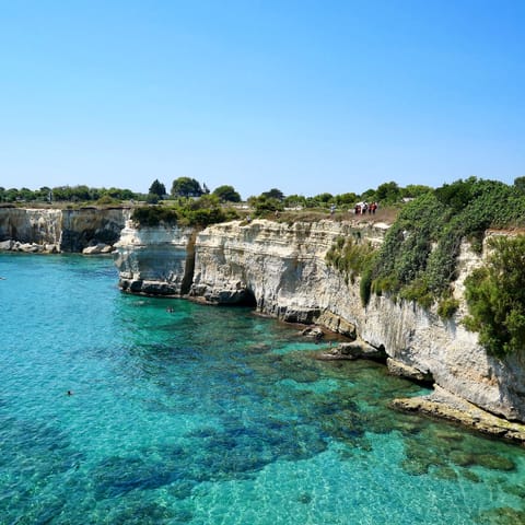 Head to the calm turquoise water of the Specchiolla coast, just a short drive away