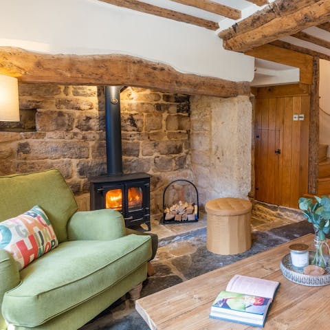 Get cosy around the wood burner with a good book and hot chocolate