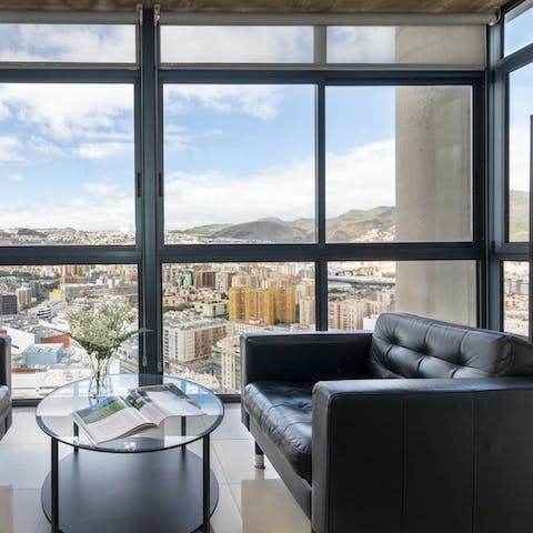 Take in sweeping views over the city and its mountains from the reading nook's floor-to-ceiling windows