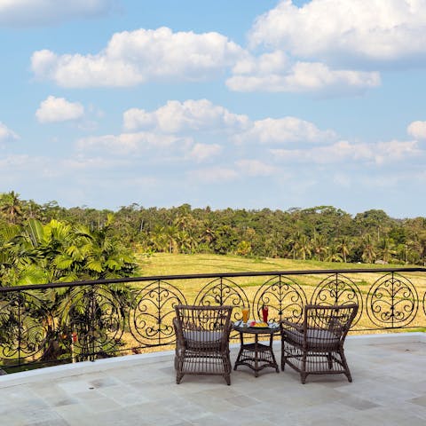 Relax with a book on the balcony, overlooking the picturesque rice fields