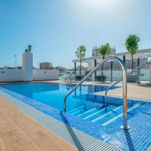 Plunge into the rooftop pool for a refreshing midday dip