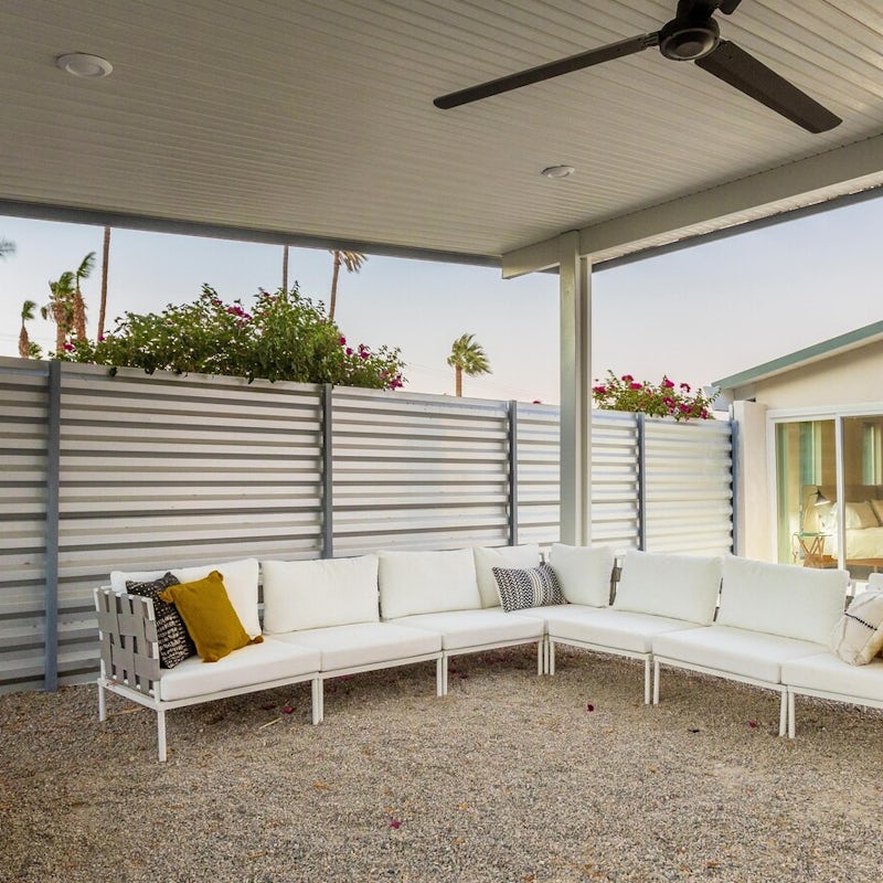 Get a taste of indoor-outdoor living, thanks to the covered lounge area