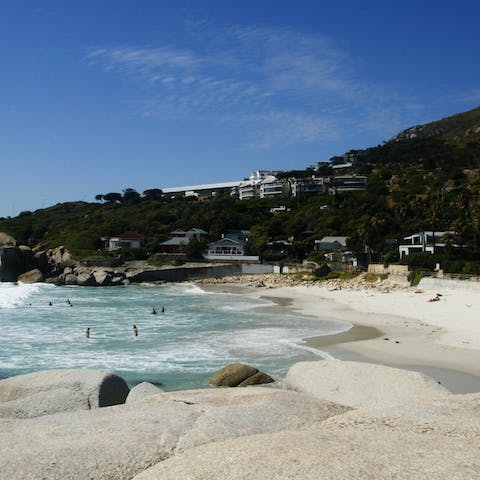 Stroll down the your steps to the white sands of Camps Bay Beach