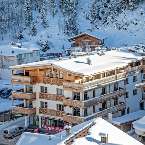 Stay in a picture-perfect chalet apartment with traditional wooden balconies