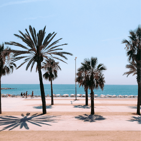 Take a stroll along Barceloneta Beach, a short walk away