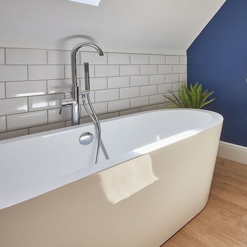 Relax your tired muscles in the freestanding tub