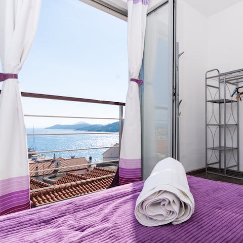 Wake up to dazzling coastal views from the bedroom's Juliet balcony