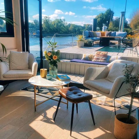 Relax in the living area while taking in beautiful river views