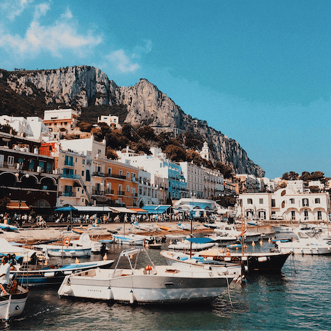 Explore the sandy beaches and pastel coloured buildings of the Amalfi Coast