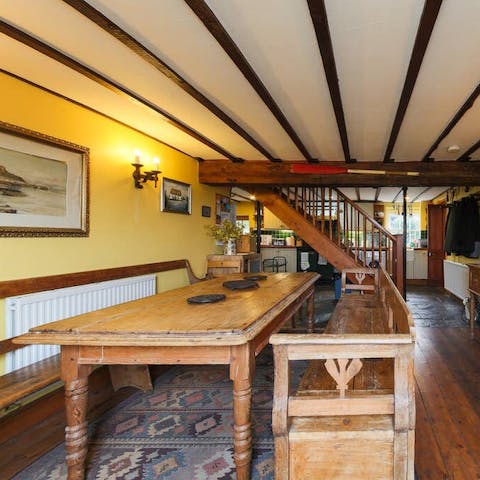 Enjoy a group meal in the bucolic dining area with exposed beams