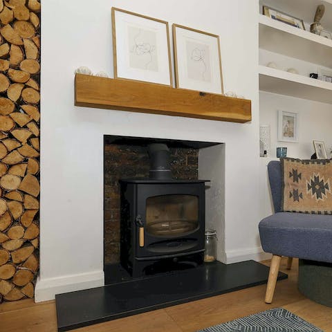Find a quiet reading spot by the rustic log burner
