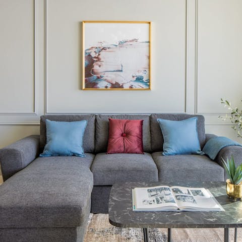 Relax on the chaise sofa in the elegant living space after a busy day in the city